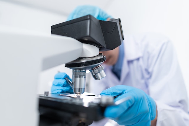 Male scientist with microscope